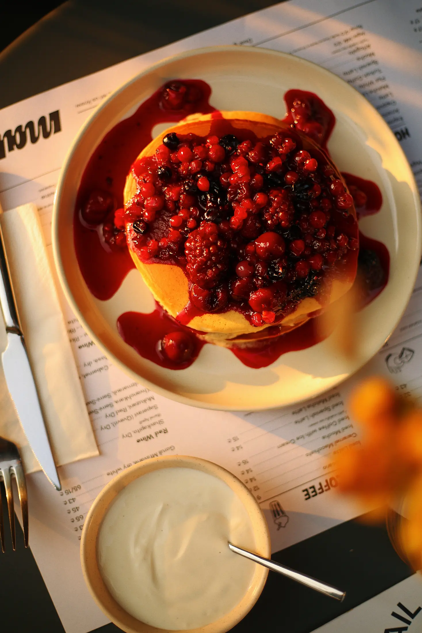 Red berry dessert in evening light